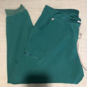 FIGS Womens Zamora scrub pant in Hunter Green.